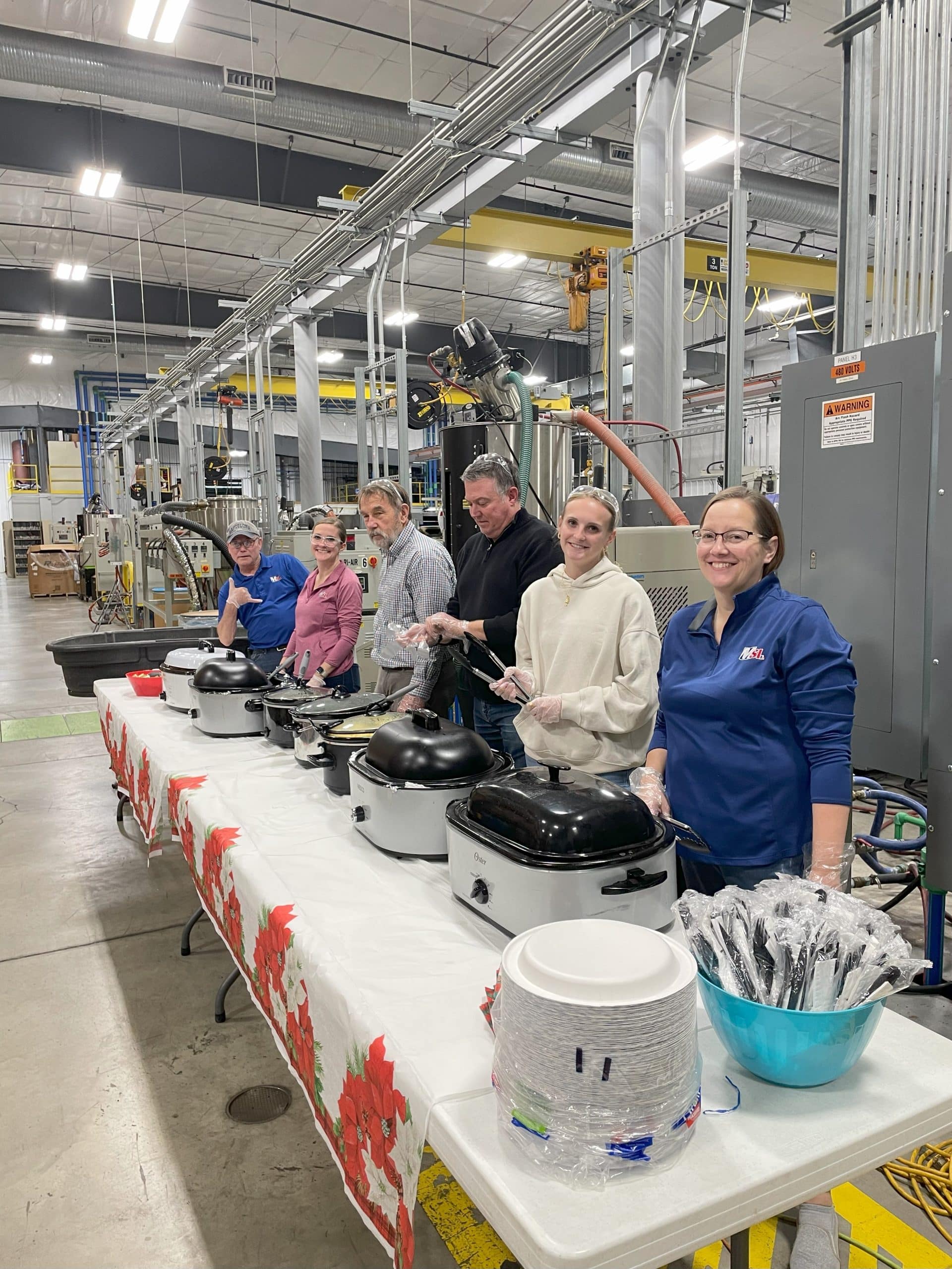 Team members pass out food for team meal